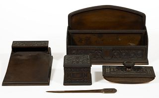 TIFFANY & CO. BRONZE SCROLL AND SHIELD FOUR-PIECE PARTIAL DESK SET,