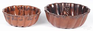 Two Pennsylvania redware molds, 19th c., 3 1/4'' h., 9 1/2'' w. and 2 3/4'' h., 7 3/4'' w.
