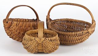 Three assorted woven baskets, early 20th c., largest - 8 1/2'' h., 11'' w.