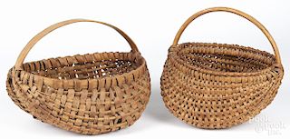 Two split oak baskets, 19th c., 10'' h., 14 1/2'' w. and 11'' h., 11 1/2'' w.
