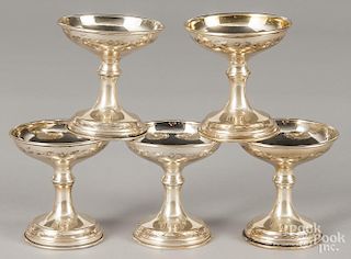 Partial set of five gold wash sterling silver candleholders, 8 ozt.