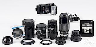Assorted camera accessories, to include a Nikon zoom-NIKKOR lens, an AF NIKKOR lens