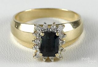 14K yellow gold and tourmaline ring with a rectangular, step cut, blue-green tourmaline
