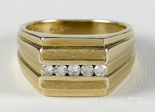 Gold and diamond ring with a 14K yellow gold band with a row of five full cut diamonds, size 9.5