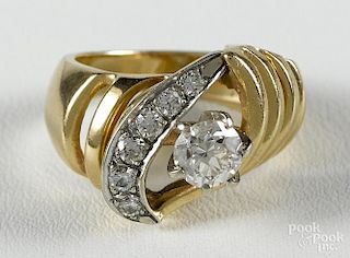 Diamond and 14K yellow gold ring with a central round, brilliant cut diamond, approx. 0.70 ct.