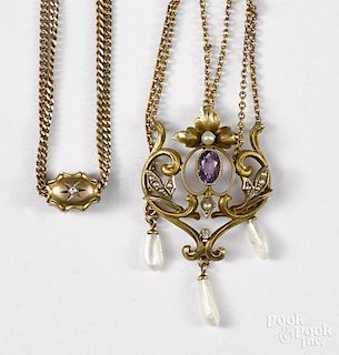 Victorian 10K yellow gold lavaliere with central amethyst and baroque seed pearl and diamond accents