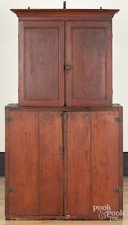 Pennsylvania stained poplar two-part cupboard, 19th c., retaining an old red surface, 72 1/2'' h.