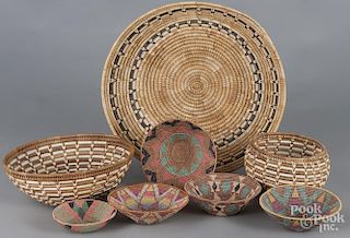Eight woven baskets, 20th c., to include several Southwest examples, largest - 4 3/4'' h., 20'' w.