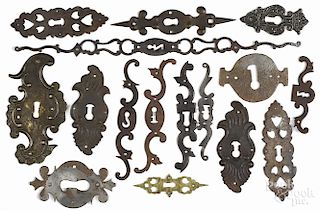 Iron, brass, and tin escutcheons, including one initialed and dated 1824, largest - 17 1/2'' l.
