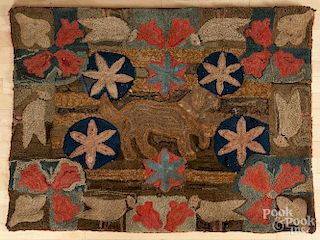 American hooked rug, mid 19th c., of a dog, birds, and flowers, 35'' x 46''.