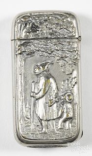 Heavily embossed nickel silver match vesta safe having a gnome with a walking stick and pipe