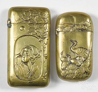 Two Japanese embossed brass match vesta safe, one with a Geisha girl, 2 3/4'' h.