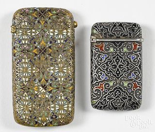 Two enameled match vesta safes, one hallmarked G?S, 1 7/8'' h., the other 2 1/2'' h.