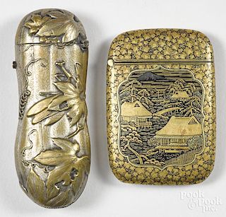 Two Japanese mixed metal match vesta safes, to include an example with embossed foliate decoration