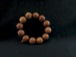 Chinese HuangHuaLi Wood Bracelet. 10cm long, 2cm each bead. 中国黄花梨木手镯。长10cm，每个珠2cm。