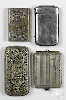 Four nickel and silver-plated match vesta safes, one with a heavy embossed image of a young couple