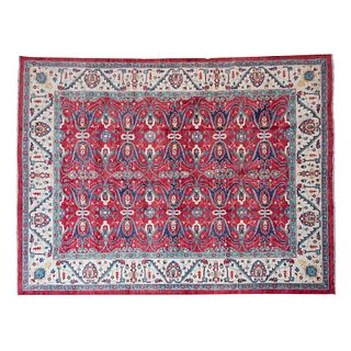 TAPETE. SXX. Estilo Kashan. Elaborado a mano en fibras de lana y algodón. Decoración floral y geométrica sobre fondo rojo