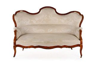 Victorian Style Carved Walnut Camelback Sofa