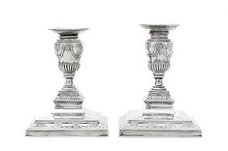 A Pair of Danish Silver Candlesticks, L. Berth, Copenhagen, 1st Half 20th Century, the step square bases chased with flowerheads