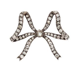 A Victorian Silver Topped Gold and Diamond Bow Brooch, 9.10 dwts.