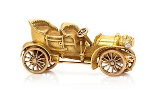 * A Yellow Gold and Diamond Articulated Antique Car Brooch, Circa 1920, 5.30 dwts.