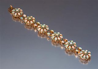 A 14 Karat Rose Gold, Opal, and Turquoise Bracelet, 19.90 dwts.