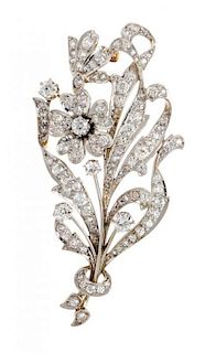 * An Edwardian Platinum Topped Gold and Diamond Flower Brooch, 13.80 dwts.