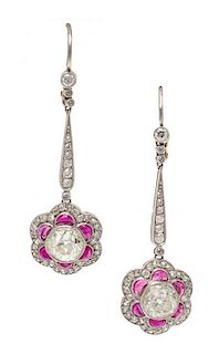 A Pair of Art Deco Platinum, Diamond and Ruby Pendant Earrings, 3.60 dwts.