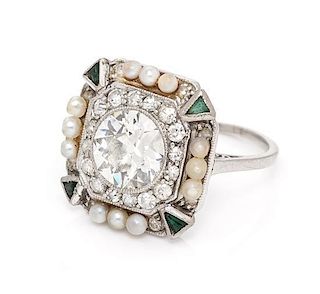 * A Platinum, Diamond, Seed Pearl and Simulated Emerald Ring, 3.10 dwts.