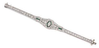 * An Art Deco Platinum, Diamond and Simulated Emerald Bracelet, 13.50 dwts.