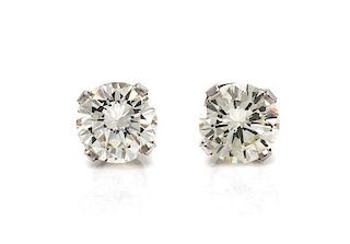 * A Pair of 18 Karat White Gold and Diamond Stud Earrings, 0.80 dwts.