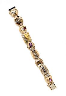 A Yellow Gold, Diamond, and Multi Gem Slide Charm Bracelet, Circa 1930, 47.40 dwts.