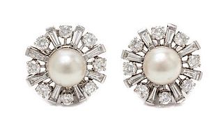 A Pair of Platinum, Diamond and Cultured Pearl Earclips, 8.60 dwts.