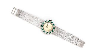 An 18 Karat White Gold, Diamond and Emerald Wristwatch, Baume & Mercier, 34.70 dwts.