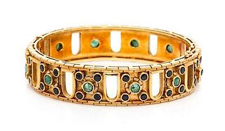 An 18 Karat Yellow Gold, Sapphire and Emerald Bangle Bracelet, Lalaounis, 36.65 dwts.