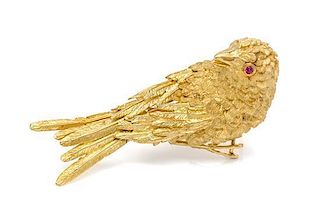* An 18 Karat Yellow Gold and Ruby Bird Brooch, 26.00 dwts.