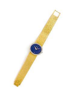 * An 18 Karat Yellow Gold, Diamond and Lapis Wristwatch, Piaget, 40.20 dwts.