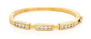 * An 18 Karat Yellow Gold and Diamond Bangle Bracelet, 17.60 dwts.