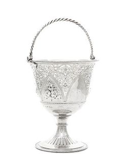 A Victorian Silver Basket, Barnard Brothers, London, 1866, on a spreading circular base with beaded rims and chased with flutes,