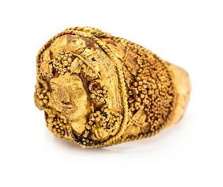 * A High Karat Yellow Gold Bacchus Motif Ring, 14.20 dwts.