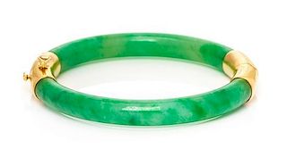 A Yellow Gold and Jadeite Jade Bangle Bracelet, 22.70 dwts.
