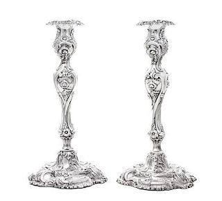 * A Pair of Victorian Silver Candlesticks, Henry Wilkinson & Co., Sheffield, 1855, on shaped circular bases with baluster stems,