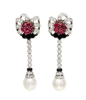 A Pair of 18 Karat Bicolor Gold, Ruby, Diamond, Cultured South Sea Pearl and Onyx En Tremblant Earclips, Ella Gem, 29.40 dwts.
