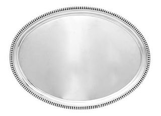 * A George III Silver Salver, William Bennett, London, 1802, oval with applied gadrooned rim, raised on four conforming bracket