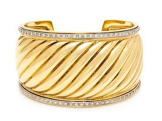 An 18 Karat Yellow Gold and Diamond "Carved Cable" Cuff Bracelet, David Yurman, 51.40 dwts.