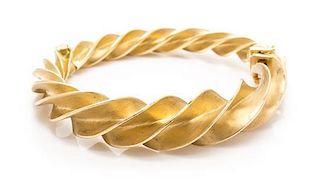 An 18 Karat Yellow Gold "Crazy Twist" Bangle Bracelet, Jean Schlumberger for Tiffany & Co., 43.00 dwts.