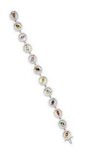 An 18 Karat White Gold, Colored Diamond and Diamond Bracelet, 11.80 dwts.