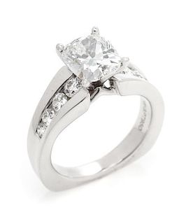 A Platinum, White Gold and Diamond Ring, 6.20 dwts.