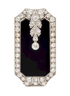 An Art Deco, Platinum, Diamond and Onyx Pendant/Clip Brooch, 11.00 dwts.