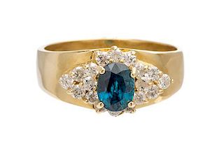 A 14 Karat Yellow Gold, Blue Topaz and Diamond Ring, 6.20 dwts.